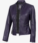 Purple leather jacket with a sleek design and quilted shoulder details. It features a front zipper, zippered side pockets, and a standing collar. Stylish and bold.