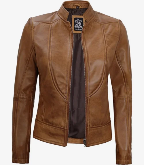 Tan leather jacket with a front zipper, open to reveal a dark inner lining. It has a fitted design with panel details, exuding a sleek, modern style.