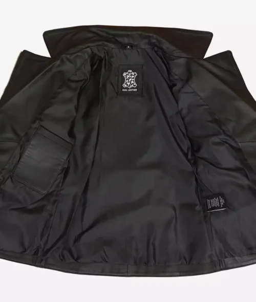 Open black leather jacket, revealing a smooth satin lining. An interior label reads Real Leather, evoking a sleek, modern, and sophisticated vibe.