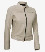 A beige leather jacket with a sleek design is displayed against a plain background. It features a front zipper and stand-up collar, conveying a modern, chic style.