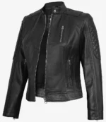 Black leather jacket with quilted shoulder panels and zippered pockets, exuding a sleek and edgy style. Standing against a plain background.