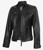 Black leather jacket with quilted shoulders, front zipper, three zip pockets, and standing collar. The design is sleek and edgy, conveying a bold style.