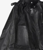 Open black leather jacket with visible interior showing quilted padding on the sleeve, zipper detail, and fabric label indicating "Real Leather."