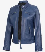 Blue leather jacket with a sleek design, featuring a high collar, zippered front, and pockets. The style is modern and conveys a bold, confident tone.