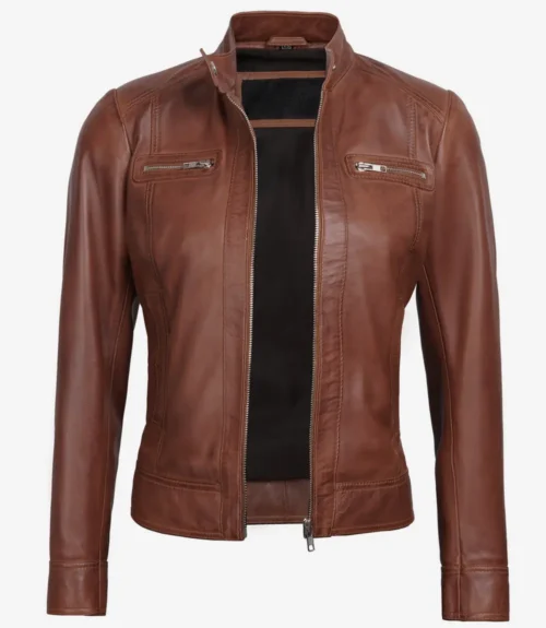 Brown leather jacket with a sleek, fitted design. Features a stand-up collar, front zipper, and two zippered chest pockets. Stylish and contemporary.