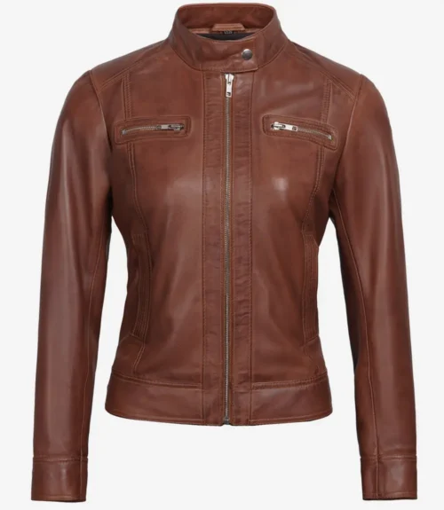 A brown leather jacket with a sleek design is displayed. It features a high collar, front zipper, and two chest zip pockets, exuding a classic, stylish vibe.