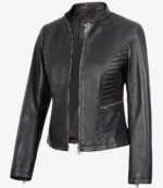 Black leather jacket with quilted shoulder and side panels, silver zippers on the front and a side pocket, exuding a sleek and edgy tone.