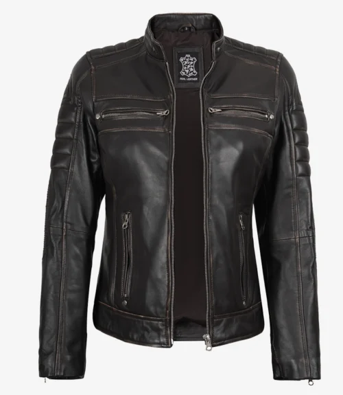 A black leather jacket with a stand collar, zipper pockets, and quilted stitching on the shoulders. It exudes a sleek, edgy vibe.