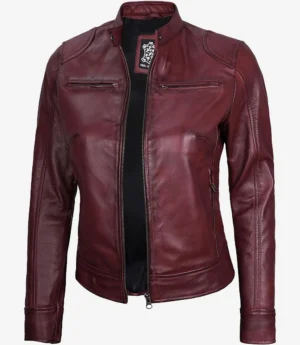Burgundy leather jacket with a sleek design, featuring zippered pockets and a stand collar. The jacket exudes a stylish and edgy vibe.