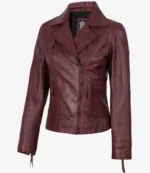Maroon leather jacket with asymmetrical front zippers and a wide collar. The sleek design and deep color give it a stylish, edgy look.