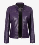 Purple leather jacket with silver zippers, featuring a sleek, modern design and standing collar. Tag inside reads Real Leather.
