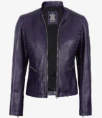 Purple leather jacket with a sleek, fitted design featuring ribbed detailing on the shoulders and sides. Two zipped side pockets add a stylish touch.