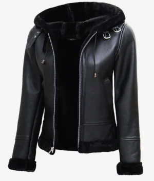 Black leather jacket with a fur-lined hood, accented by silver zippers and buckles. The style is sleek and modern, conveying a bold, edgy tone.