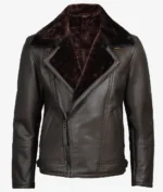 Dark brown leather jacket with a plush fur lining and wide collar. It features an asymmetrical zipper and two vertical pockets, exuding a rugged, stylish vibe.