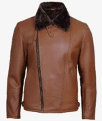 Brown leather jacket with an asymmetrical front zipper and dark fur collar. It has two angled pockets and a sleek, modern design.