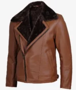 Brown leather jacket with a diagonal zipper and plush dark brown lining. It features a large collar, side pockets, and conveys a stylish, cozy look.