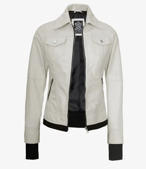 A light beige leather jacket with a high collar and prominent buttoned pockets. The jacket is open, revealing a black inner lining.