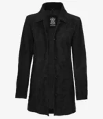 A sleek black leather coat with a classic collar and buttoned front, exuding a timeless, sophisticated style. The label inside reads "Real Leather."