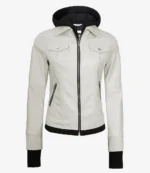 Cream leather jacket with buttoned chest pockets, zippers, and black inner lining, exuding a sleek and modern style against a white background.