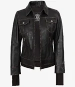 Brown leather jacket with dark brown stitching, featuring a zipper closure. It has a collared neck, two chest pockets with button flaps, and ribbed cuffs.