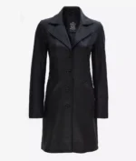 A sleek, black leather coat with four buttons and wide lapels. The coat is tailored with a classic, sophisticated design, featuring side pockets.