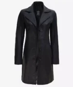 Black leather coat with a sleek, tailored design, featuring a notched collar and five buttons. The coat exudes a classic, stylish look.