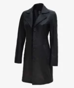 A sleek, black leather trench coat with a notched lapel, button closure, and side pockets. The coat exudes a stylish and classic vibe.