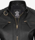 Black leather jacket with gold zipper, quilted shoulders, and D-ring detail. Label reads Real Leather with a leather pattern logo, conveying a sleek, stylish tone.