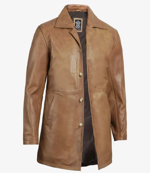 Tan leather long coat with a classic collar and four-button closure. The coat has smooth texture, two side pockets, and a dark inner lining.
