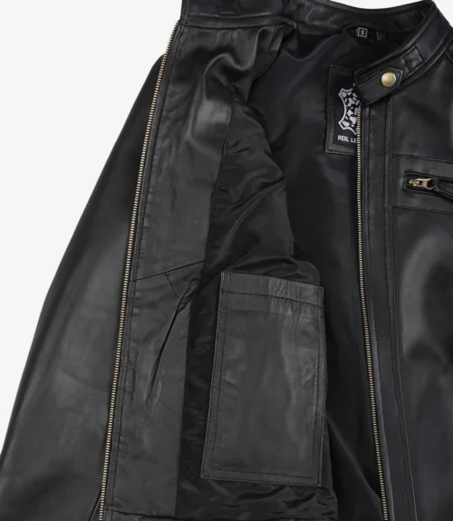 Open black leather jacket showing the inner lining with a label near the collar and an inner pocket. Zipper and button details are visible.