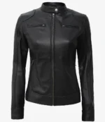 Sleek black leather jacket with a stand collar, zippered front, shoulder detailing, and zippered pockets. It conveys a stylish, edgy tone.