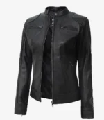 Sleek black leather jacket with a mandarin collar, front zipper partially open. Two zippered chest pockets and slanted side pockets, creating a stylish look.