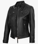 A sleek black leather jacket with quilted shoulders, featuring a front zip closure and multiple zippered pockets. The look is edgy and stylish.