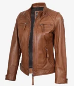 Brown leather jacket with a quilted shoulder pattern, zippered pockets, and a stand-up collar. The jacket is open, showing a black inner lining.