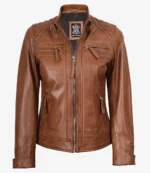 Brown leather jacket with a front zipper, quilted shoulder details, and four zippered pockets. The tag reads "Real Leather." Stylish and rugged design.