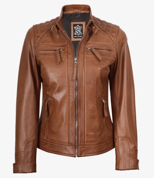 Brown leather jacket with a front zipper, quilted shoulder details, and four zippered pockets. The tag reads "Real Leather." Stylish and rugged design.